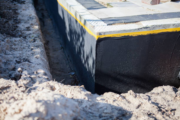 Professional Emergency Waterproofing technician working in Butlerville, IN